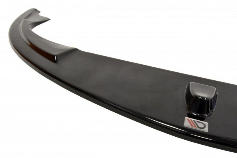 pol_po_FRONT-SPLITTER-suitable-for-Alfa-Romeo-147-GTA-621_6jpg - OPSHOLDERS Curved black rear car spoiler with a chrome badge on glossy finish, seen at an angle.
