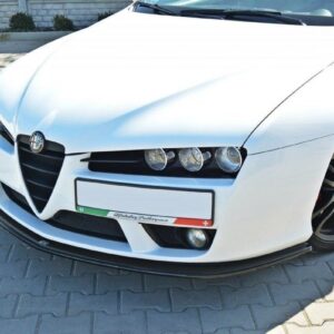 White Alfa Romeo, front-left angled view, parked on gray pavers, showing distinctive grille and triple headlights.