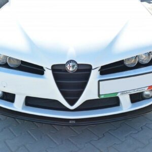 Front view of a white Alfa Romeo car featuring the distinctive V-shaped grille and round headlights with the brand badge centered on the hood, parked on a paved surface.