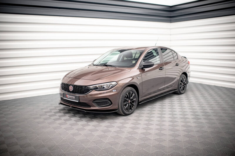 Brown Fiat sedan in a white showroom, front three-quarter view on a checkered floor in the background.