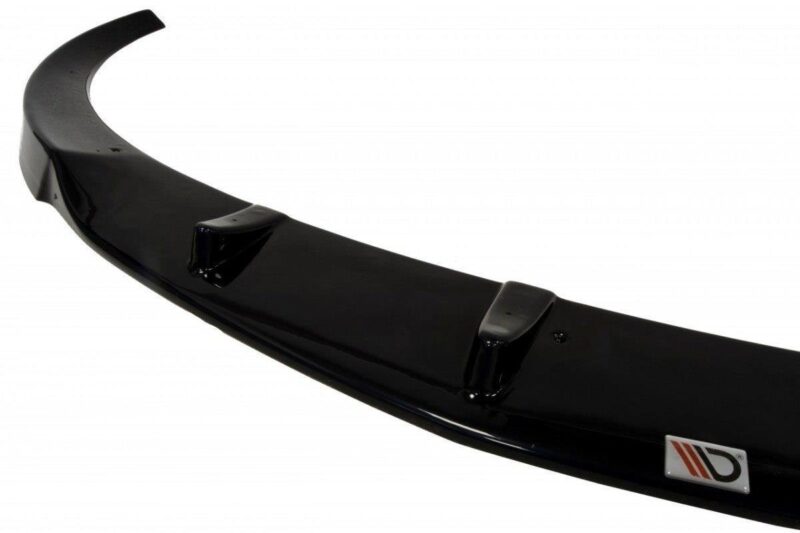 Glossy black car rear spoiler with mounting brackets visible on the curved surface