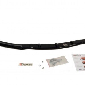 Glossy black curved car spoiler lip with mounting brackets, screws, and installation guide sheet laid out nearby.
