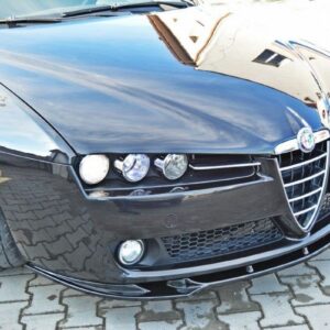 Front view of a black Alfa Romeo car parked on a cobblestone surface, highlighting the distinctive grille and three headlamps on the left side of the bumper.