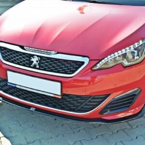 Red Peugeot front view with grille, emblem and LED headlight on a brick-paved surface,