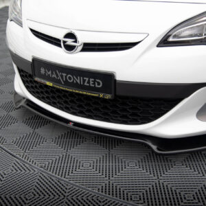 Front view of a white Opel car, emblem visible, with a black plate reading #MAXTONIZED on a showroom floor.