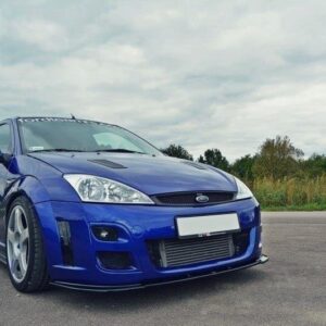 Blue modified hatchback car, front-left angle on an empty road with a sporty body kit and intercooler visible behind the grille.