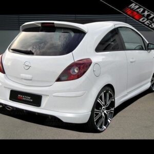 White Opel hatchback parked outdoors, rear three-quarter view with black multi-spoke aftermarket wheels and Maxton Design branding.