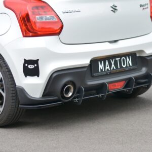 Rear view of a white Suzuki hatchback with a Maxton license plate, pig decal on the bumper, and dual exhausts.