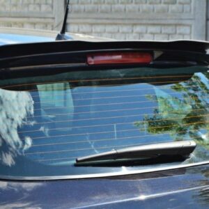 Dark blue car rear window with defroster lines and rear wiper, reflecting clouds and trees in bright daylight