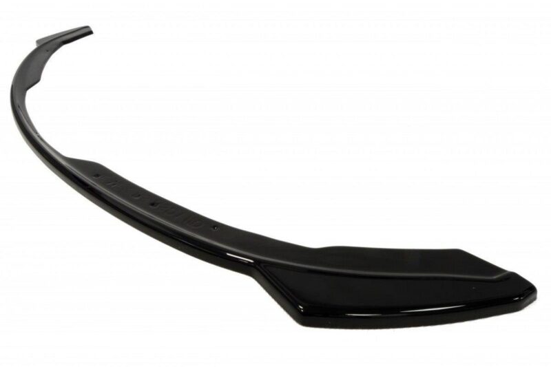 Black curved plastic tool with a wide flat end, resembling a shoehorn or ergonomic paddle