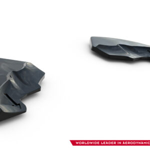 Two damaged dark gray aerodynamic components lying on a white background, with a brand logo visible in the bottom right corner and a red banner text along the edge.