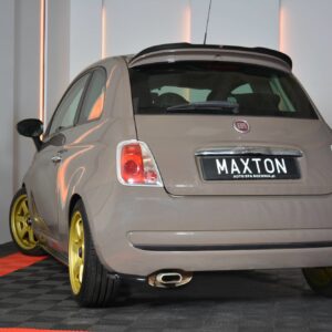 pol_po_Rear-Side-Splitters-suitable-for-Fiat-500-7185_4jpg - OPSHOLDERS Rear view of a beige Fiat 500 with bright gold wheels in a showroom, license plate reads MAXTON.