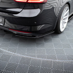 pol_po_Rear-Side-Splitters-suitable-for-Renault-Talisman-1143_3jpg - OPSHOLDERS Black luxury car rear with glossy finish and a bold license plate reading #MAXTONIZED, parked on a checkered showroom floor.