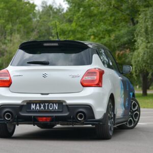 pol_po_Rear-Side-Splitters-suitable-for-Suzuki-Swift-Mk6-8260_4jpg - OPSHOLDERS Rear view of a silver Suzuki Swift Sport with a black spoiler and Maxton license plate, parked on pavement with trees in the background.
