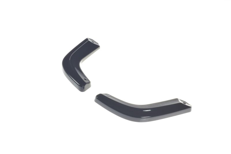 pol_po_Rear-Side-Splitters-suitable-for-Suzuki-Swift-Mk6-8260_8jpg - OPSHOLDERS Two glossy black curved plastic pieces with small holes, isolated on a white background
