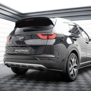 Rear view of a black Kia Sportage in a modern showroom, showing the red taillights and a #MALTONIZED license plate.