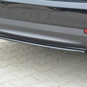 pol_po_Rear-Splitter-suitable-for-Saab-9-3-Aero-Mk2-Facelift-1054_3jpg - OPSHOLDERS Close-up of a dark car's rear bumper with two chrome exhaust tips and a gray diffuser.