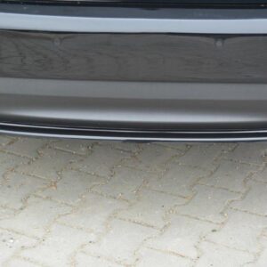 pol_po_Rear-Splitter-suitable-for-Saab-9-3-Aero-Mk2-Facelift-1054_4jpg - OPSHOLDERS Rear view of a gray car showing dual chrome exhaust pipes and a low-profile bumper on a brick-paved surface.