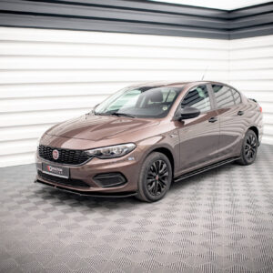 Brown Fiat sedan photographed in a bright, minimalist showroom with white paneled walls and a checkered floor, shown from the front-right.