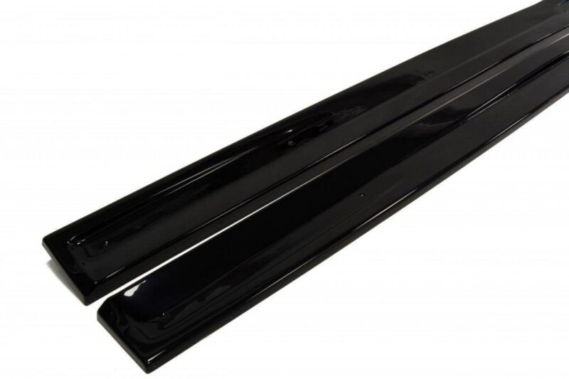 pol_po_SIDE-SKIRTS-DIFFUSERS-suitable-for-Opel-ASTRA-H-FOR-OPC-VXR-238_5jpg - OPSHOLDERS Two long, glossy black metal rails displayed at an angle on a white background.
