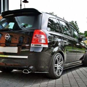 pol_po_SIDE-SKIRTS-DIFFUSERS-suitable-for-Opel-ZAFIRA-B-OPC-254_6jpg - OPSHOLDERS Black Opel Zafira OPC minivan parked on a brick-paved driveway with a brick building in the background.