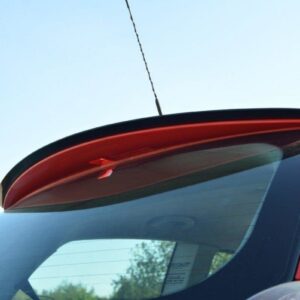 pol_po_SPOILER-CAP-suitable-for-Fiat-STILO-SCHUMACHER-VERSION-1271_3jpg - OPSHOLDERS Red car viewed from the side rear, highlighting a small roof antenna and curved rear window with defroster lines visible in the glass.