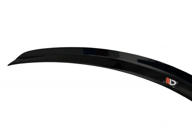 pol_po_SPOILER-CAP-suitable-for-Fiat-STILO-SCHUMACHER-VERSION-1271_5jpg - OPSHOLDERS Black curved car spoiler piece with a glossy finish and a small orange logo on the right edge? (informative)