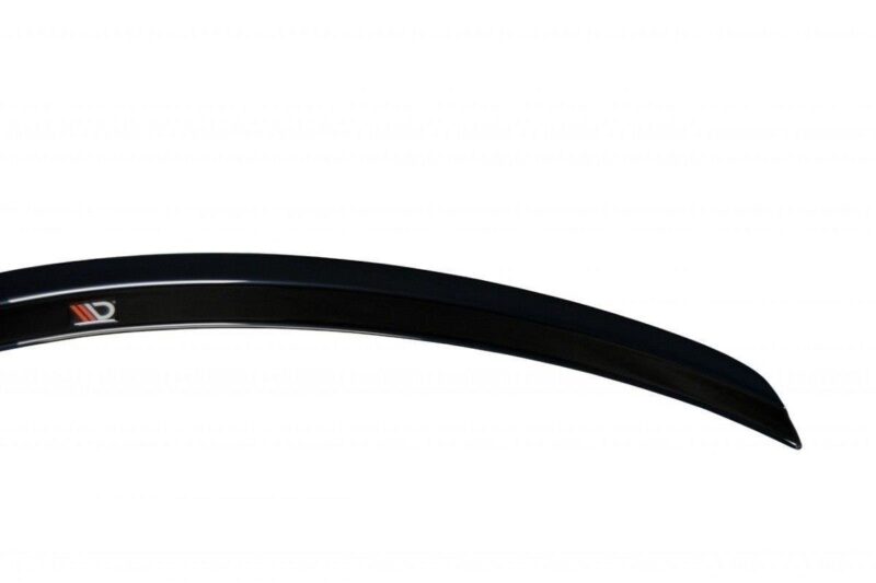 pol_po_SPOILER-CAP-suitable-for-Fiat-STILO-SCHUMACHER-VERSION-1271_6jpg - OPSHOLDERS Close-up of a curved black bicycle rim with a small red-and-white logo on a white background.