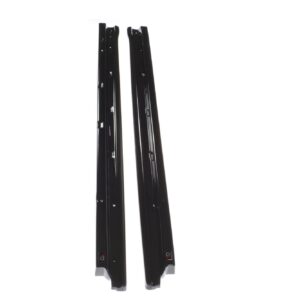 Pair of black ski bindings standing upright on a white background