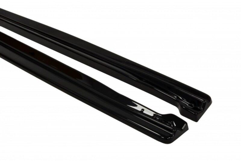 Pair of black windshield wiper blades lying diagonally on a white background, glossy finish evident.
