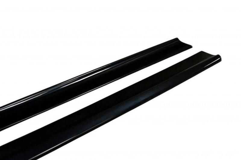 pol_po_Side-Skirts-Diffusers-suitable-for-Fiat-Stilo-Schumacher-2784_4jpg - OPSHOLDERS Two glossy black roof rack bars angled across a white background, likely crossbars for a vehicle roof.