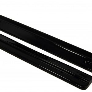 Pair of black car windshield wiper blades lying parallel on a white background, photographed from above.
