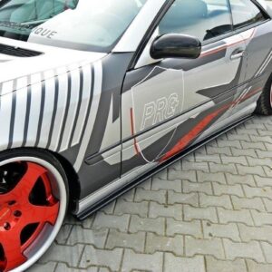 Grey sports car with white, red, and silver graphic wrap and large red rims viewed from the side on a paved surface