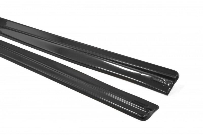 Two glossy black car trim rails laid diagonally on a white background.