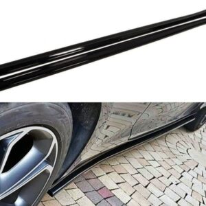Two glossy black car side skirts laid out on a white background for product display.