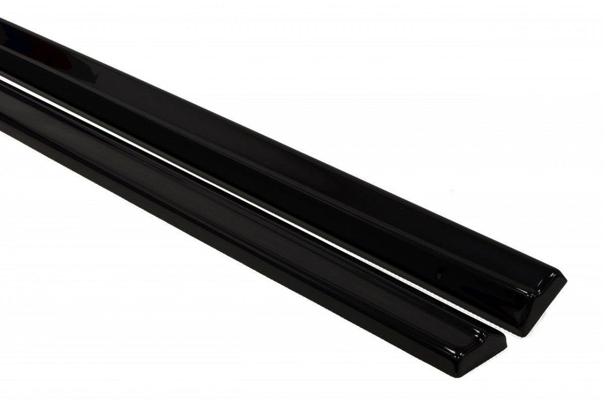pol_po_Side-Skirts-Diffusers-suitable-for-Opel-Astra-GTC-J-241_2jpg - OPSHOLDERS Two glossy black rectangular metal rails lying diagonally.