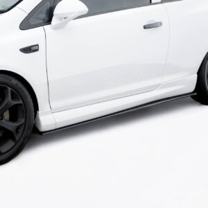 White sports car side profile with black multi-spoke wheels and yellow brake calipers visible through the rims.