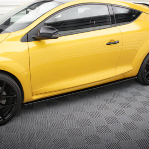 Close-up of a bright yellow sports car door and black alloy wheel with red brake caliper on a checkered floor edge.
