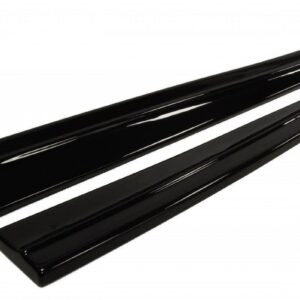 Two long glossy black trim bars lying diagonally on a white background
