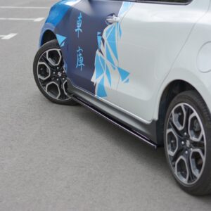 pol_po_Side-Skirts-Diffusers-suitable-for-Suzuki-Swift-Sport-Mk6-8264_1jpg - OPSHOLDERS Partial side view of a silver hatchback with bold blue geometric wrap and Chinese characters on the door panel