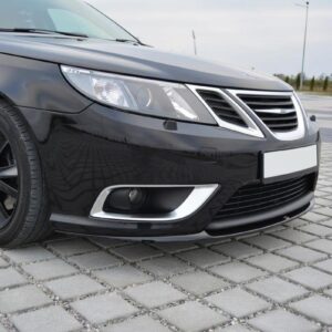 Front-left view of a black sedan on a paved surface, showing the grille, headlight and lower bumper."],