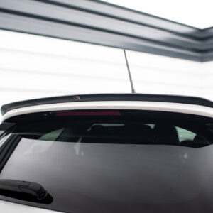 Rear view of a white SUV showing the roof spoiler and antenna atop the roof edge near the back window.