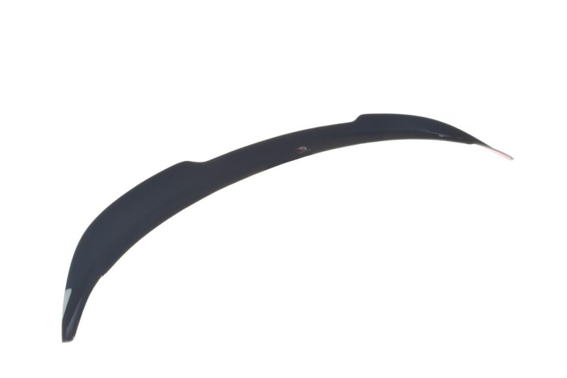pol_po_Spoiler-Cap-suitable-for-Suzuki-SWIFT-6-SPORT-8255_7jpg - OPSHOLDERS Close-up of a dark curved plastic piece with a small red-and-white logo along its surface against a white background.